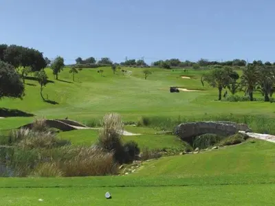 a view of a golf course with a green at Villa Montanha, 4 Bedroom Villa, with swimming pool, loungers and alfresco dining, 10 min walk to the beautiful Praia da Luz Beach, Shops, Bars and Restaurants! in Luz