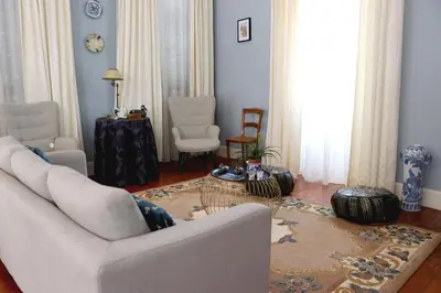 a living room with a couch and a table at Casa Charmosa in Funchal