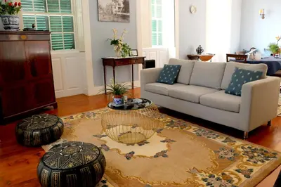 a living room with a couch and a table at Casa Charmosa in Funchal