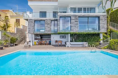 a swimming pool in front of a house at Beach House - By WeHost in Santa Cruz