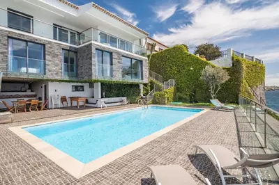 an exterior view of a house with a swimming pool at Beach House - By WeHost in Santa Cruz