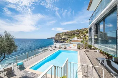 a view of the ocean from a house with a swimming pool at Beach House - By WeHost in Santa Cruz