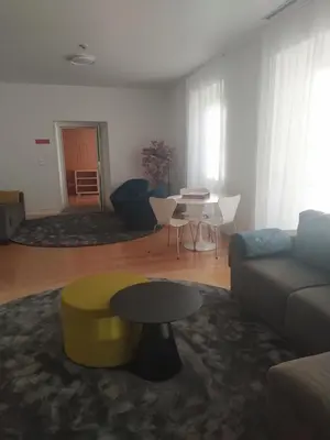 a living room with a couch and a table at Azores Youth Hostels - Santa Maria in Vila do Porto