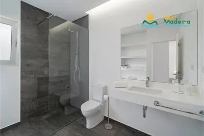 a bedroom with three beds and a window at OurMadeira - CalhetaScape in Calheta
