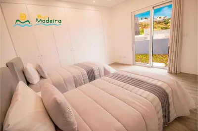 a bathroom with a sink and a toilet and a shower at OurMadeira - CalhetaScape in Calheta