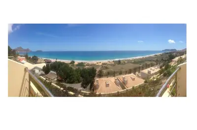 a view of the beach from the balcony of a building at Pedra do Jota in Porto Santo