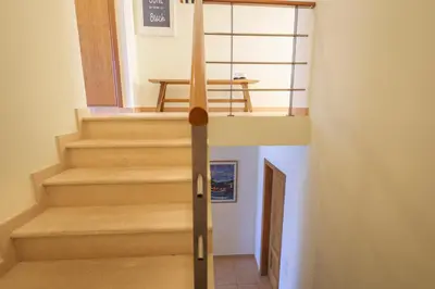 a staircase in a house with a stair case at Pedra do Jota in Porto Santo