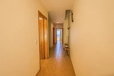 a hallway with a hallway leading into a room at Pedra do Jota in Porto Santo