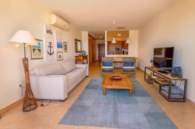 a living room with a couch and a table at Pedra do Jota in Porto Santo