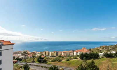 a view of the ocean from a building at Savana Apartment By Atlantic Holiday in Nogueira