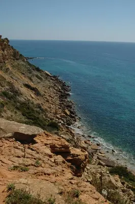 a view of the ocean from a cliff at Cantinho do Burgau in Burgau