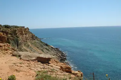 a view of the ocean from a cliff at Cantinho do Burgau in Burgau