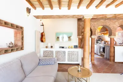 a living room with a couch and a table at Beachhouse Algarve, Beach 50m in Salema
