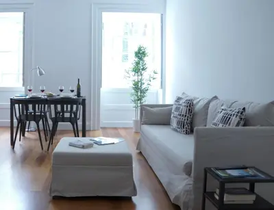 a living room with a couch and a table at Heritage Apartments in Funchal