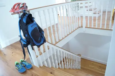 a backpack on a stand next to a staircase at Heritage Apartments in Funchal