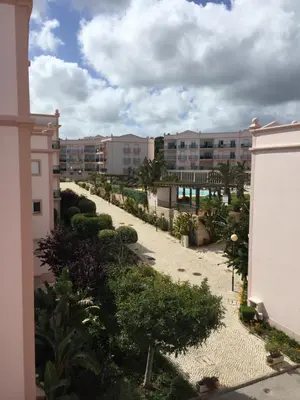 a view of a courtyard with trees and buildings at ST JAMES in Luz