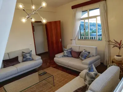 a living room with two couches and a window at Atlantic house in Gaula