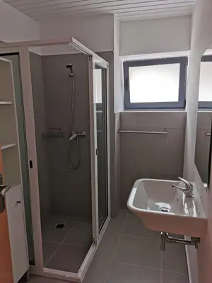 a bathroom with a shower and a sink at Lucas House in Ponta do Sol