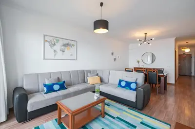 a living room with a couch and a table at Garajau III by An Island Apart in Caniço