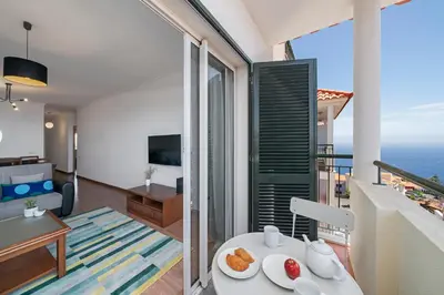 a living room with a view of the ocean at Garajau III by An Island Apart in Caniço