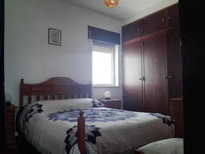 a bedroom with a bed and a window at Arrifana View Flat - 2km Praia Arrifana in Aljezur