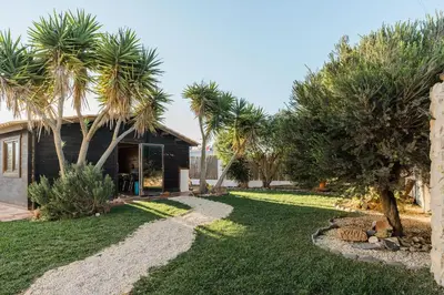 a bedroom with a bed in a room at Aldeia Caiçara Surf House in Sagres