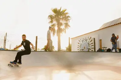 a group of people sitting in a yoga class at Aldeia Caiçara Surf House in Sagres