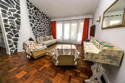 a living room with a couch and a table at Casa Maravilha II in Caniço