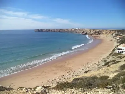 an empty road in the middle of the desert at Apartamento Mahalo in Sagres