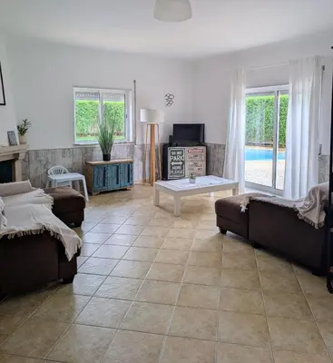 a living room with a couch and a coffee table at Apartamento Mahalo in Sagres