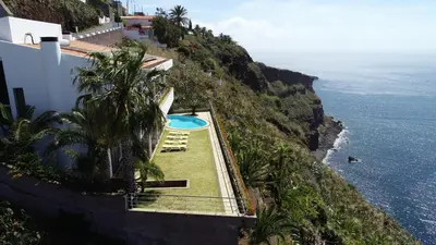 a view of the ocean from a house at An uninterrupted 180 overlooking the Atlantic Ocean in Caniço