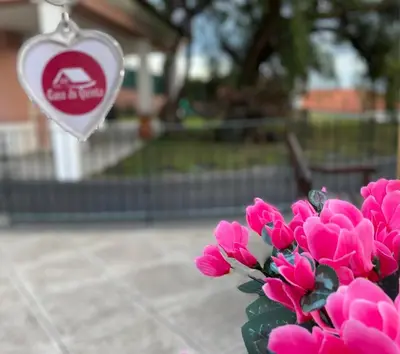 a bouquet of pink flowers in front of a heart at Studio by Casa da Quinta in Funchal