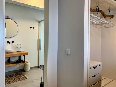 a bathroom with a sink and a mirror at Calheta Boutique Houses in Arco da Calheta