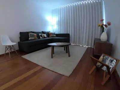 a living room with a couch and a table at Freda House in Funchal