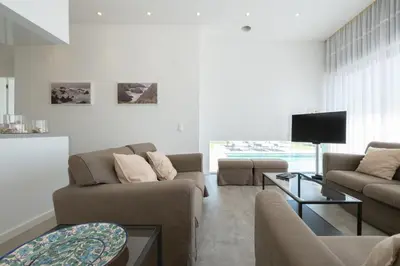 a living room with two couches and a tv at Bela Vista da Luz 17 by Destination Algarve in Luz