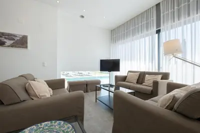 a living room with two couches and a television at Bela Vista da Luz 17 by Destination Algarve in Luz