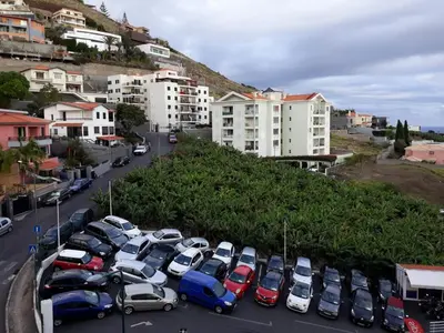 a bunch of cars parked in a parking lot at Elegant Apartment with Sea Views by Trip2Portugal in Funchal