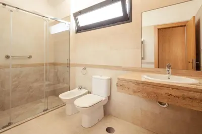 a bathroom with a toilet and a sink and a shower at Elegant Apartment with Sea Views by Trip2Portugal in Funchal