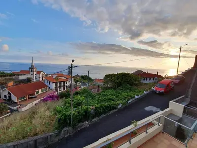 a view of a town with a car on a street at Ponte House in Porto Moniz