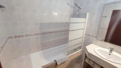 a bathroom with a shower and a sink at Casa do Mar in Salema