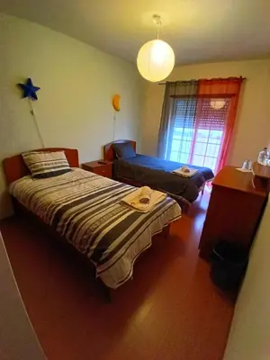 a bathroom with a toilet and a sink and a tub at CASA DIAS in Vila do Bispo