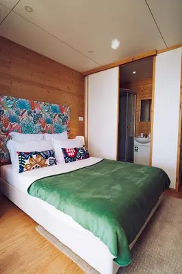 a bedroom with a large bed with pillows on it at Calheta Glamping Pods - Nature Retreat in Calheta