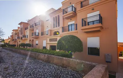 a building with balconies on the side of a street at B27 - LuzBay 2 Bed Apartment in Luz