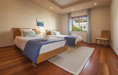 a hotel room with two beds and a window at B27 - LuzBay 2 Bed Apartment in Luz