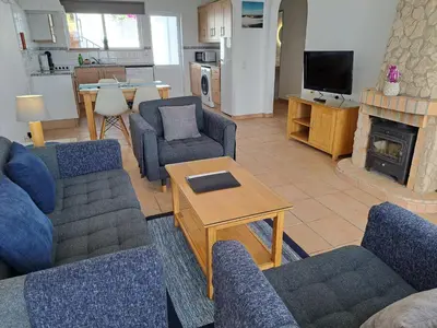 a living room with two couches and a table at Ocean Villas Luz in Luz