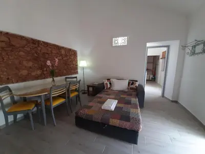 a living room with a couch and a table at Quinta do Maranhão in Lagos