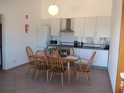 a bathroom with a toilet and a sink at Quinta do Maranhão in Lagos