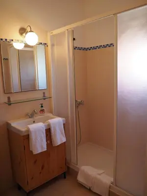 a bathroom with a sink and a mirror at Quinta do Maranhão in Lagos
