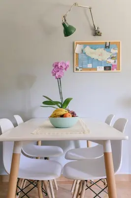 a table with a bowl of fruit and a flower on it at Atlantis Flat. Relaxing Moments in Machico