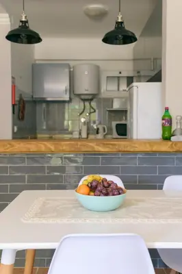 a bowl of fruit on a table in a kitchen at Atlantis Flat. Relaxing Moments in Machico